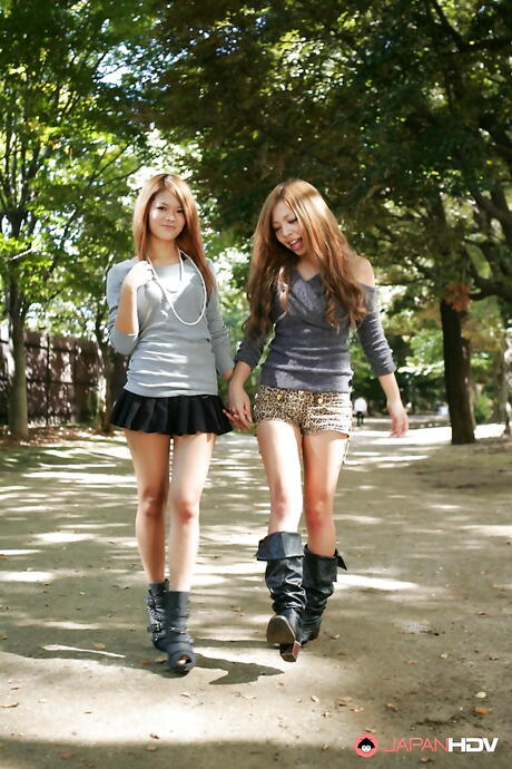 Amazing girls Tsubasa and Kanon in shorts enjoy some playful lesbian foreplay outside